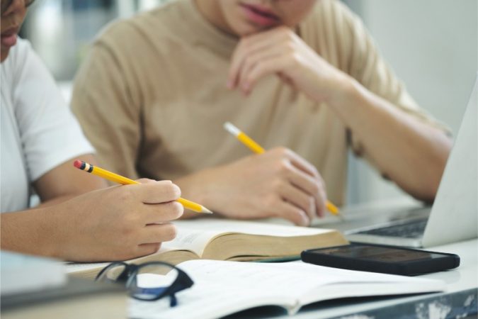 Campus students helping friend