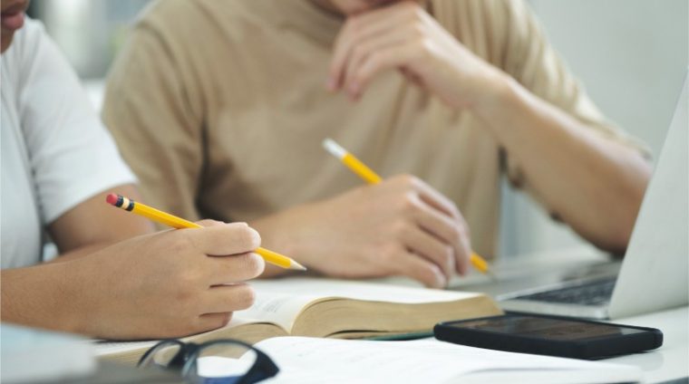 Campus students helping friend